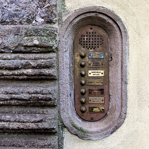 In the ancient walled city of Lucca, Italy, an image is captured of the ancient Roman invention of a door intercom, ha ha! (In a crusty old brass panel with quirky old buttons surrounded by carved stone are the delicious names: Balducci, Artuzzi, Bianchi, Mattioli, and Fattorini Pizza.) In the ancient walled city of Lucca, Italy, an image is captured of the ancient Roman invention of a door intercom, ha ha! (In a crusty old brass panel with quirky old buttons surrounded by carved stone are the delicious names: Balducci, Artuzzi, Bianchi, Mattioli, and Fattorini Pizza.)