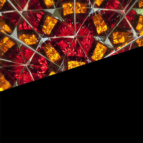 Partial image of a brightly multi-coloured kaleidoscope Partial image of a brightly multi-coloured kaleidoscope